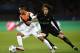 Shakhtar Donetsk's Brazilian midfielder Alex Teixeira (L) vies with Paris Saint-Germain's French midfielder Adrien Rabiot during the UEFA Champions League Group A football match between Paris-Saint-Germain and Shakhtar Donetsk on December 8, 2015 at the Parc des Princes stadium in Paris. AFP PHOTO / FRANCK FIFE / AFP / FRANCK FIFE (Photo credit should read FRANCK FIFE/AFP/Getty Images)