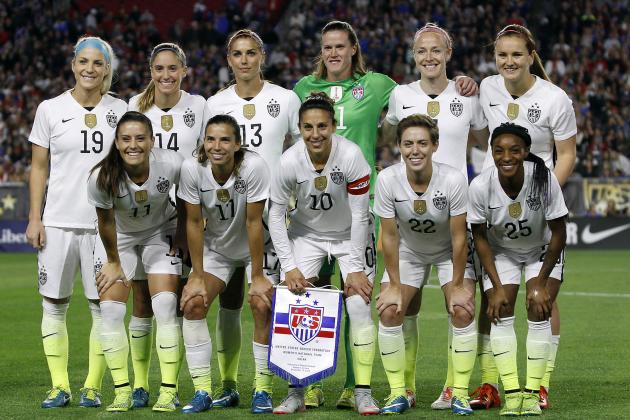United States', from left, Julie Johnston (19), Ali Krieger (11), Morgan Briam (14), Tobin Heath (17), Alex Morgan (13), Carli Lloyd (10), Alyssa Naeher, back center, Meghan Klingenberg (22), Becky Sauerbrunn (4), Crystal Dunn (25) and Lindsey Horan, top right, pose for a team photo before an international friendly soccer match against China, Sunday, Dec. 13, 2015, in Glendale, AZ. (AP Photo/Ralph Freso)