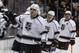 Los Angeles Kings left wing Milan Lucic, center, celebrates with the bench players after center Tyler Toffoli, second from right, scores as center Anze Kopitar, right, of Slovenia, looks on during the second period of an NHL hockey game against the Anaheim Ducks in Anaheim, Calif., Sunday, Jan. 17, 2016. (AP Photo/Alex Gallardo)