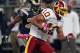 Washington Redskins wide receiver Jabar Gaffney (10) carries the ball after catching a pass for a 20-yard gain as St. Louis Rams cornerback Quintin Mikell, left, defends during the first quarter of the NFL football game Sunday, Oct. 2, 2011, in St. Louis. (AP Photo/Jeff Roberson)
