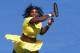 Serena Williams of the United States hits a forehand return to Margarita Gasparyan of Russia during their fourth round match at the Australian Open tennis championships in Melbourne, Australia, Sunday, Jan. 24, 2016.(AP Photo/Rafiq Maqbool)