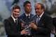 FC Barcelone Argentinian striker Lionel Messi receives from UEFA president Michel Platini (R) the trophy of Best Men's player in Europe next to runner-up Portugal's Cristiano Ronaldo at the end of the UEFA Champions League Group stage draw ceremony, on August 27, 2015 in Monaco. AFP PHOTO / VALERY HACHE (Photo credit should read VALERY HACHE/AFP/Getty Images)