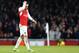 Arsenal's Mesut Ozil puts his hand to his head as he waits for a free kick to be taken during the English Premier League soccer match between Arsenal and Chelsea at the Emirates stadium in London, Sunday, Jan. 24, 2016.(AP Photo/Frank Augstein)