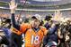 Denver Broncos quarterback Peyton Manning waves to spectators following the NFL football AFC Championship game between the Denver Broncos and the New England Patriots, Sunday, Jan. 24, 2016, in Denver. The Broncos defeated the Patriots 20-18 to advance to the Super Bowl. (AP Photo/Charlie Riedel)