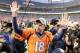 Denver Broncos quarterback Peyton Manning waves to spectators following the NFL football AFC Championship game between the Denver Broncos and the New England Patriots, Sunday, Jan. 24, 2016, in Denver. The Broncos defeated the Patriots 20-18 to advance to the Super Bowl. (AP Photo/Charlie Riedel)