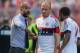 Munich's coach Pep Guardiola, left, addresses Arjen Robben, center, and Douglas Costa de Souza during the German soccer cup first round match between fifth tier team FC Noettingen and Bayern Munich in Karlsruhe, southern Germany, Sunday, Aug. 9, 2015. (AP Photo/Daniel Maurer)
