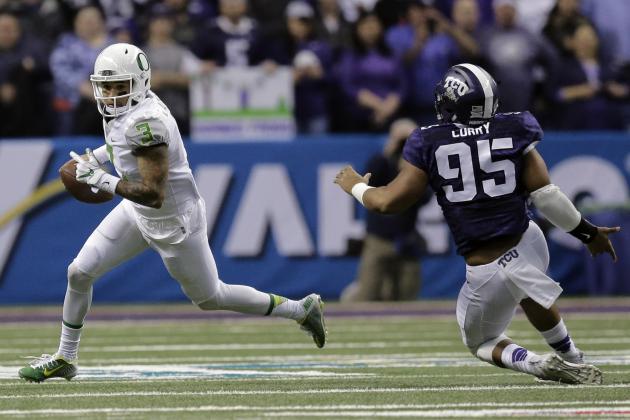 Oregon quarterback Vernon Adams Jr. (3) runs around TCU defensive tackle Aaron Curry (95) during the first half of the Alamo Bowl NCAA college football game Saturday, Jan. 2, 2016, in San Antonio. (AP Photo/Eric Gay)