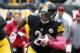 Pittsburgh Steelers running back Le'Veon Bell (26) carries the ball during an NFL football game against the Arizona Cardinals, Sunday, Oct. 18, 2015 in Pittsburgh. (AP Photo/Gene J. Puskar)