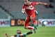 Tunisian Mohamed Ali Monsser (top) vies for the ball with Morocco's defender Rachid Tiberkanine during an African Nations Championship (CHAN) qualifying match on October 25, 2015 in Rades. Both Tunisia and Morocco have already quallified for the 16-nation tournament, which Rwanda host in January and February. AFP PHOTO / FETHI BELAID (Photo credit should read FETHI BELAID/AFP/Getty Images)
