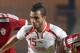 Tunisian midfielder Mohamed Ali Moncer (C) is defended by Libyan midfielder Marouane Mansour (R) and El Moatassem Bellah Mosrati (L) during their a 2016 African Nations Championship qualifying football match on October 19, 2015 in Rades Olympic Stadium, outside Tunis. AFP PHOTO / FETHI BELAID (Photo credit should read FETHI BELAID/AFP/Getty Images)