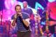 FILE - In this Sunday, Nov. 22, 2015 file photo, Chris Martin of Coldplay performs at the American Music Awards at the Microsoft Theater, in Los Angeles. Coldplay will perform at the Pepsi Super Bowl 50 Halftime Show on CBS Sunday, Feb. 7, 2016, the NFL announced on Thursday, Dec. 3, 2015. (Photo by Matt Sayles/Invision/AP, File)