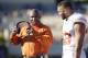 Texas head coach Charlie Strong during the first half/ second half of an NCAA college football game, Saturday, Nov. 14, 2015, in Morgantown, W.Va. (AP Photo/Raymond Thompson)