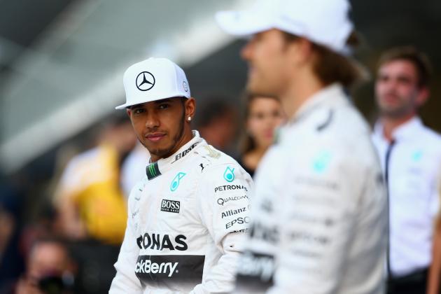 ABU DHABI, UNITED ARAB EMIRATES - NOVEMBER 29:  Lewis Hamilton of Great Britain and Mercedes GP and Nico Rosberg of Germany and Mercedes GP take part in the team photograph in the pit lane before the Abu Dhabi Formula One Grand Prix at Yas Marina Circuit on November 29, 2015 in Abu Dhabi, United Arab Emirates.  (Photo by Clive Mason/Getty Images)