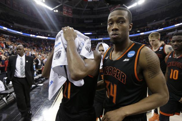 Mercer's Langston Hall and Jibri Bryan (34) walks off the court after the second half of an NCAA college basketball third-round tournament game against Tennessee , Sunday, March 23, 2014, in Raleigh. Tennessee Won 83-63. (AP Photo/Chuck Burton)
