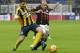 AC Milan's Nigel de Jong, right, challenges for the ball with Verona’s Federico Viviani during the Serie A soccer match between AC Milan and Hellas Verona at the San Siro stadium in Milan, Italy, Sunday, Dec. 13 , 2015. (AP Photo/Antonio Calanni)