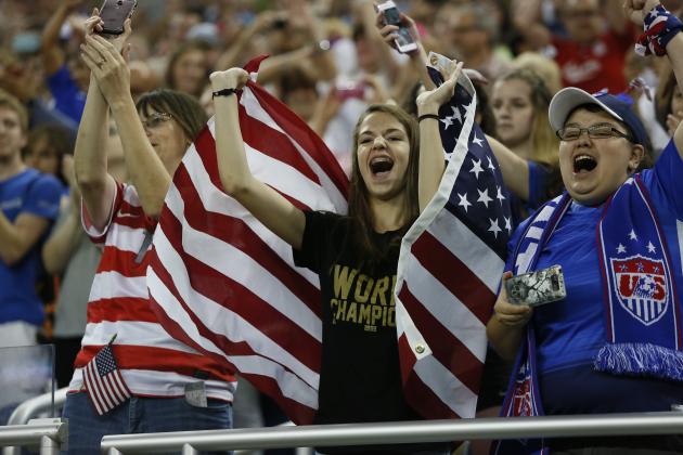 DETROIT, MI - SEPTEMBER 17: Mikaila Moore, 13, of Grand Rapids, Michigan, center, cheers for the U.S. Women's 2015 World Cup players before a victory tour match against Haiti at Ford Field on September 17, 2015, in Detroit, Michigan. (Photo by Duane Burleson/Getty Images)