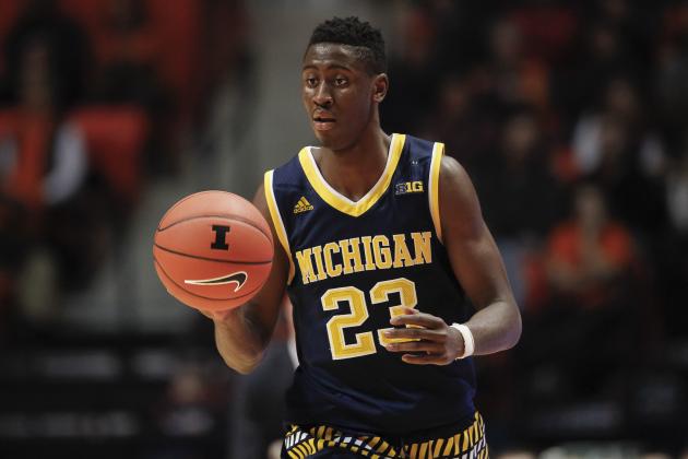CHAMPAIGN, IL - DECEMBER 30: Caris LeVert #23 of the Michigan Wolverines brings the ball up court during the game against the Illinois Fighting Illini at State Farm Center on December 30, 2015 in Champaign, Illinois.  (Photo by Michael Hickey/Getty Images)