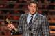 J.J. Watt, of the Houston Texans, accepts the AP defensive player of the year award on stage at the 4th annual NFL Honors at the Phoenix Convention Center Symphony Hall on Saturday, Jan. 1, 2015. (Photo by Frank Micelotta/Invision for NFL/AP Images)