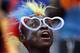 FILE - A Saturday, Jan. 31, 2015 file photo showing a Democratic Republic of Congo soccer fan cheering on his team during the African Cup of Nations quarter final soccer match between Congo and DR Congo in Bata, Equatorial Guinea. (AP Photo/Themba Hadebe, File)