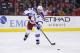 New York Rangers defenseman Ryan McDonagh (27) passes the puck in the first period of an NHL hockey game against the Washington Capitals, Sunday, Jan. 17, 2016, in Washington. (AP Photo/Alex Brandon)