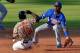 Adonis Garcia (L) of Venezuela slides safe at second base against Puerto Rico during their 2016 Caribbean baseball series game on February 6, 2016 in Santo Domingo, Dominican Republic. AFP PHOTO/YAMIL LAGE / AFP / YAMIL LAGE (Photo credit should read YAMIL LAGE/AFP/Getty Images)