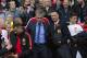 Chelsea's manager Jose Mourinho, center left, makes his way from the opposition dugout after greeting Manchester United manager Louis van Gaal, centre right, during their English Premier League soccer match between Manchester United and Chelsea at Old Trafford Stadium, Manchester, England, Sunday Oct. 26, 2014. (AP Photo/Jon Super)