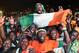 Ivory Coast football fans in Abidjan celebrate on February 8, 2015, after their national team won the Africa Cup of Nations. Ivory Coast faced Ghana in the final held in Bata, Equatorial Guinea, and won in a penalty shootout 9-8. AFP PHOTO/ SIA KAMBOU (Photo credit should read SIA KAMBOU/AFP/Getty Images)