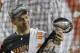 Denver Broncos’ Peyton Manning (18) holds up the trophy after the NFL Super Bowl 50 football game Sunday, Feb. 7, 2016, in Santa Clara, Calif. The Broncos beat the Panthers 24-10. (AP Photo/Marcio Jose Sanchez)
