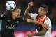PSG's Marquinhos, left, challenges for the ball with Shakhtar's Alex Teixeira during the Champions League Group A soccer match between PSG and FC Shakhtar at the Parc des Princes stadium in Paris, France, Tuesday, Dec. 08, 2015. (AP Photo/Christophe Ena)