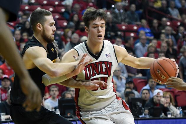 LAS VEGAS, NV - DECEMBER 16:  Stephen Zimmerman Jr. #33 of the UNLV Rebels is fouled by Eric Jacobsen #21 of the Arizona State Sun Devils during their game at the Thomas & Mack Center on December 16, 2015 in Las Vegas, Nevada.  (Photo by Ethan Miller/Getty Images)