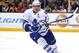 Toronto Maple Leafs defenseman Dion Phaneuf keeps his eye on a loose puck against the Boston Bruins during the second period of an NHL hockey game in Boston, Saturday, Nov. 21, 2015. (AP Photo/Winslow Townson)
