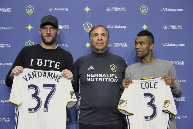 LA Galaxy head coach and general manager, Bruce Arena, center, introduces Jelle Van Damme, left, from Standard Liege in Belgium, and former Arsenal and Chelsea defender Ashley Cole at the StubHub Center in Carson, Calif., on Friday, Feb. 5, 2016. With the signing, Van Damme and Cole join Steven Gerrard and Robbie Keane as the biggest stars on the LA Galaxy. (AP Photo/Damian Dovarganes)