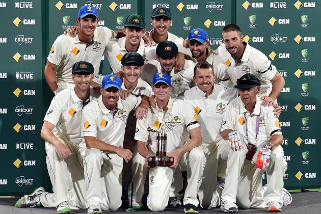 Australia's team captain Steve Smith (C) poses with teammates after defeating New Zealand in the first day-night cricket Test match at the Adelaide Oval on November 29, 2015. AFP PHOTO / SAEED KHAN
IMAGE RESTRICTED TO EDITORIAL USE - NO COMMERCIAL USE / AFP / SAEED KHAN        (Photo credit should read SAEED KHAN/AFP/Getty Images)