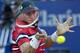 John Isner of the United States returns the ball to Dusan Lajovic of Serbia during the ATP Argentina Open in Buenos Aires, Argentina, Wednesday, Feb. 10, 2016. (AP Photo/Natacha Pisarenko)