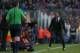 FC Barcelona's coach Luis Enrique, right, reacts after Lionel Messi, second right on the ground, received a fault during a Spanish La Liga soccer match between FC Barcelona and Atletico Madrid at the Camp Nou stadium in Barcelona, Spain, Saturday, Jan. 30, 2016. (AP Photo/Manu Fernandez)