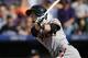 San Francisco Giants' Matt Duffy follows the flight of his triple to drive in two runs off Colorado Rockies starting pitcher Yohan Flande in the fifth inning of a baseball game Sunday, Sept. 6, 2015, in Denver. San Francisco won 7-4. (AP Photo/David Zalubowski)
