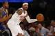 Golden State Warriors forward Andre Iguodala (9) defends New York Knicks forward Carmelo Anthony (7) in the first half of an NBA basketball game at Madison Square Garden in New York, Sunday, Jan. 31, 2016. (AP Photo/Kathy Willens)