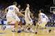Duke's Grayson Allen, center, reacts with Marshall Plumlee (40), Brandon Ingram and Derryck Thornton (12) following Allen's game winning shot as time expired to beat Virginia in an NCAA college basketball game in Durham, N.C., Saturday, Feb. 13, 2016. Duke won 63-62. (AP Photo/Gerry Broome)