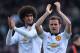 Manchester United's Belgian midfielder Marouane Fellaini (L) and Manchester United's Spanish midfielder Juan Mata (R) applaud at the end of the English Premier League football match between Crystal Palace and Manchester United at Selhurst Park in south London on May 9, 2015. AFP PHOTO / GLYN KIRK
RESTRICTED TO EDITORIAL USE. NO USE WITH UNAUTHORIZED AUDIO, VIDEO, DATA, FIXTURE LISTS, CLUB/LEAGUE LOGOS OR LIVE SERVICES. ONLINE IN-MATCH USE LIMITED TO 45 IMAGES, NO VIDEO EMULATION. NO USE IN BETTING, GAMES OR SINGLE CLUB/LEAGUE/PLAYER PUBLICATIONS. (Photo credit should read GLYN KIRK/AFP/Getty Images)