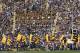 LSU cheerleaders carry flags across the end zone after the Tigers scored a touchdown against Kentucky in Baton Rouge, La., Saturday, Oct. 1, 2011. LSU defeated Kentucky 35-7in an NCAA college football game. (AP Photo/Bill Haber)