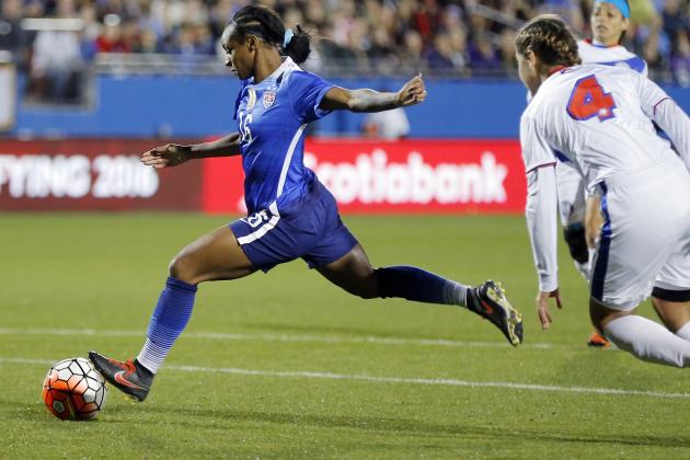 United States forward Crystal Dunn (16) attempts a shot on goal as Puerto Rico midfielder Viviana Fiol Vilches (4) defends during the first half of a women's Olympic qualifying soccer match, Monday, Feb. 15, 2016 in Frisco, Texas. (AP Photo/Brandon Wade)