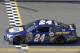 Chase Elliott crosses the finish line to qualify for the pole position in the NASCAR Daytona 500 auto race at Daytona International Speedway, Sunday, Feb. 14, 2016, in Daytona Beach, Fla. (AP Photo/John Raoux)