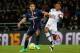 Paris Saint Germain's Brazilian defender Marquinhos, left, battles for the ball with Lyon's Cameroonian forward Clinton N'Jie during the League One soccer match between Lyon and Paris Saint-Germain, at the Gerland Stadium, in Lyon, central France, Sunday Feb. 8, 2015. (AP Photo/Claude Paris)