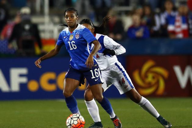 FRISCO, TX - FEBRUARY 15:  Crystal Dunn #16 dribbles the ball against Ashley Rivera #14 of Puerto Rico during CONCACAF Women's Olympic Qualifying at Toyota Stadium on February 15, 2016 in Frisco, Texas.  (Photo by Ronald Martinez/Getty Images)