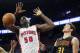 Detroit Pistons’ Joel Anthony (50) dunks against Atlanta Hawks' Mike Muscala (31) during the second half of a preseason NBA basketball game Friday, Oct. 23, 2015, in Auburn Hills, Mich. The Pistons defeated the Hawks 115-87. (AP Photo/Duane Burleson)