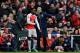 Arsenal's French manager Arsene Wenger, right, gives instructions to Danny Welbeck during the English Premier League soccer match between Arsenal and Leicester City at the Emirates Stadium in London, Sunday, Feb. 14, 2016. (AP Photo/Matt Dunham)