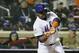 New York Mets' Juan Uribe hits an RBI single during the sixth inning of Game 3 of the Major League Baseball World Series against the Kansas City Royals Friday, Oct. 30, 2015, in New York. (AP Photo/David J. Phillip)