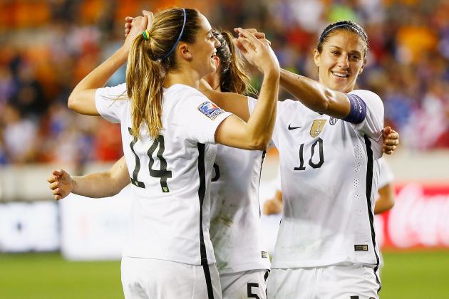 HOUSTON, TX - FEBRUARY 19:  Morgan Brian #14 and  Carli Lloyd #10 of the United States celebrate after Lloyd scored a goal in the first half of their game against Trinidad and Tobago during their Semifinal of the 2016 CONCACAF Women's Olympic Qualifying at BBVA Compass Stadium on February 19, 2016 in Houston, Texas.  (Photo by Scott Halleran/Getty Images)