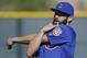 Chicago Cubs starting pitcher Jake Arrieta stretches during spring baseball practice in Mesa, Ariz., Saturday, Feb. 20, 2016. (AP Photo/Chris Carlson)