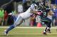 Seattle Seahawks quarterback Russell Wilson, right, is tackled by Detroit Lions defensive tackle Tyrunn Walker in the second half of an NFL football game, Monday, Oct. 5, 2015, in Seattle. (AP Photo/Scott Eklund)